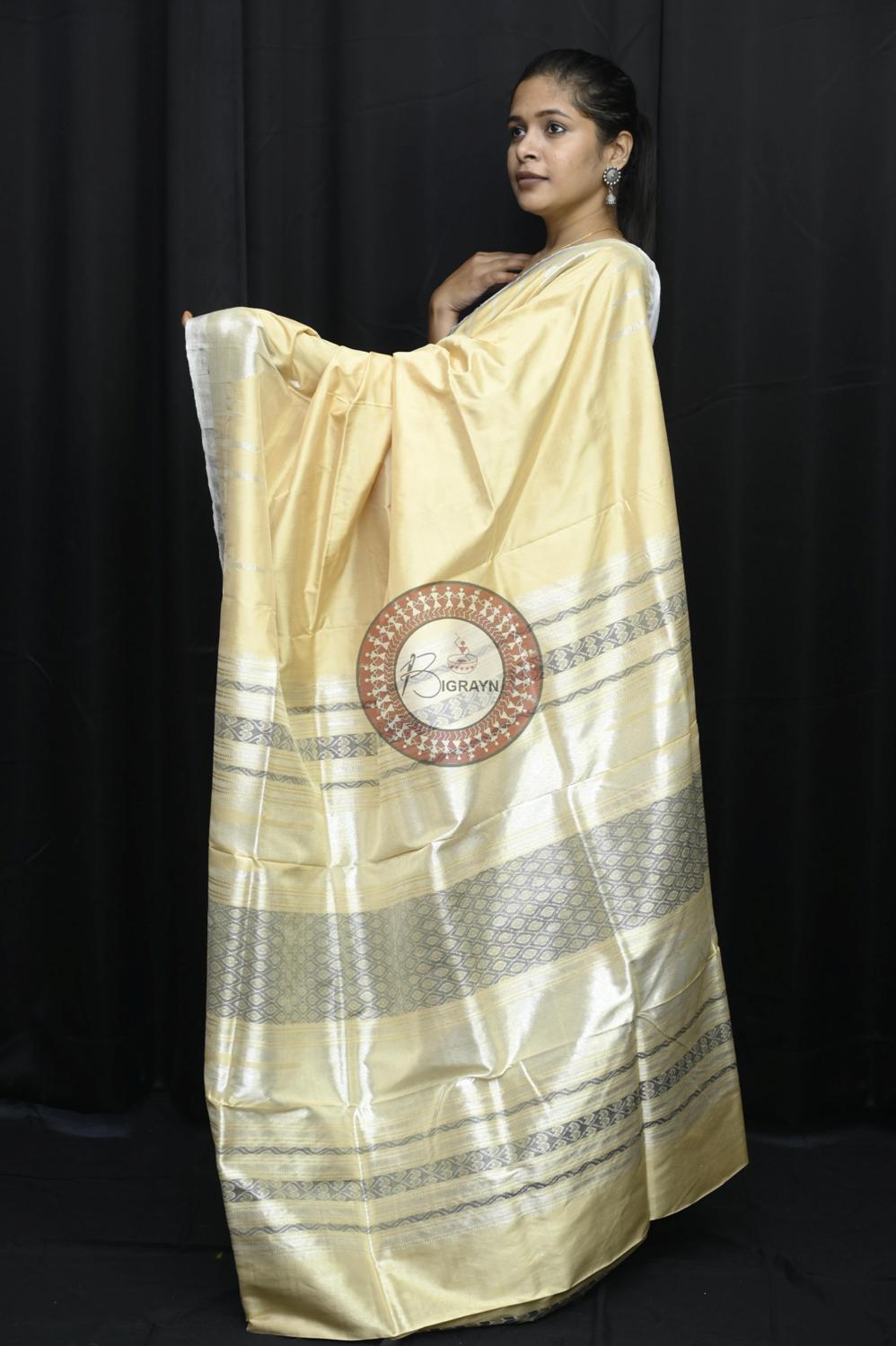 "Odisha Handloom Tissue Silk Saree with shimmering texture, elegant zari border, and lightweight drape, handcrafted by artisans"