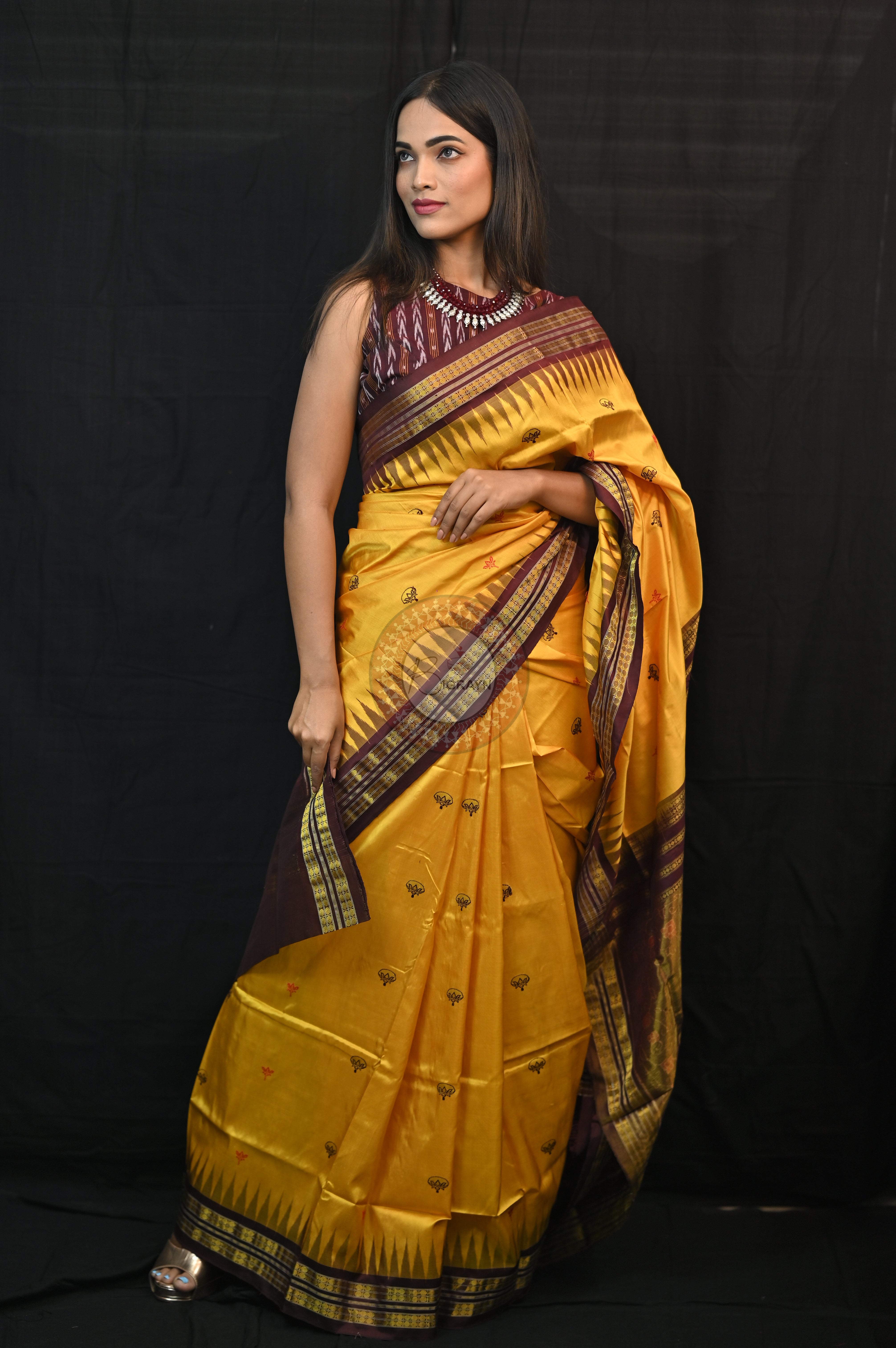 "Odisha Handloom Tissue Silk Saree with shimmering texture, elegant zari border, and lightweight drape, handcrafted by artisans"