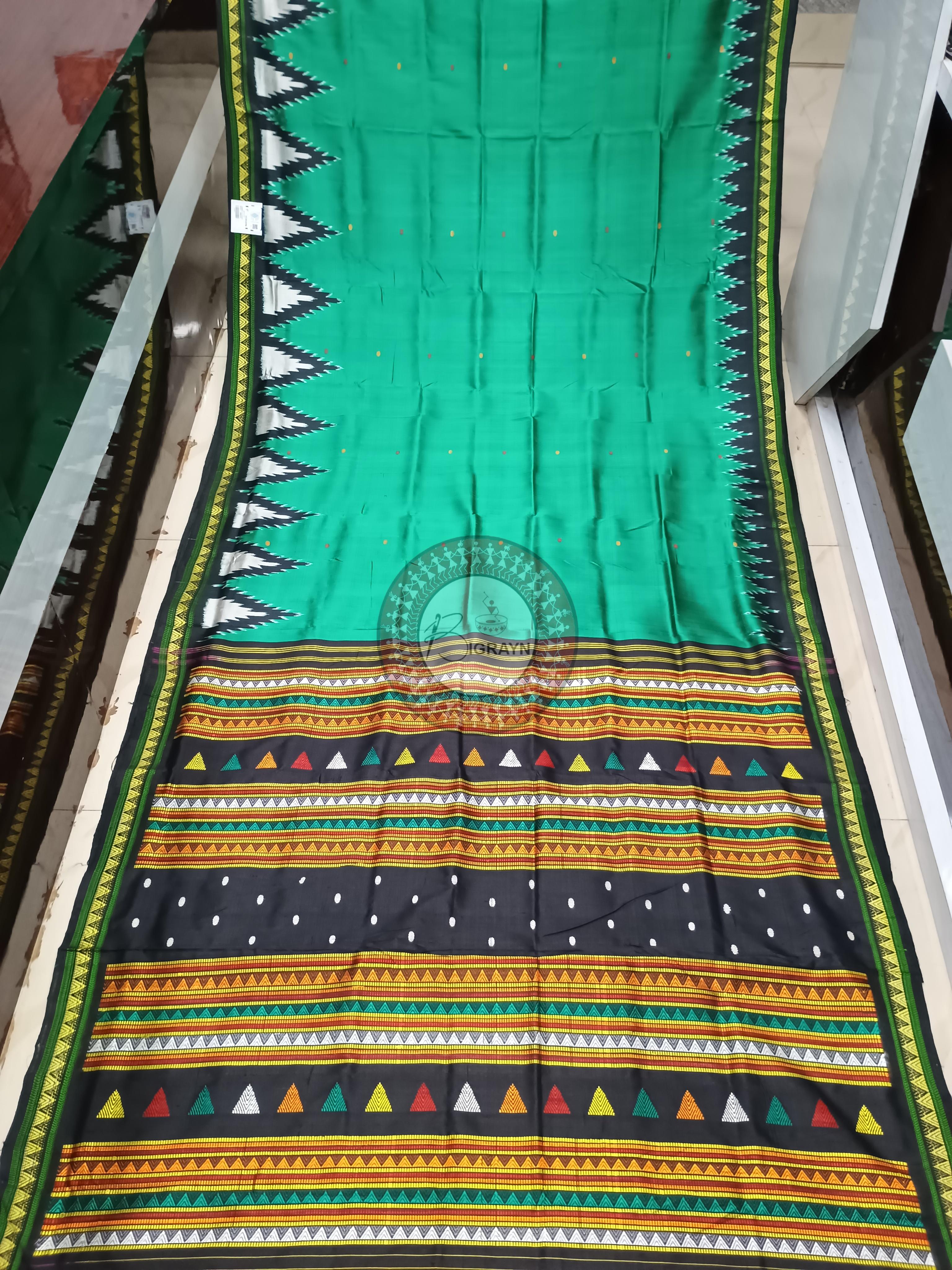 Traditional Khandua silk saree from Odisha with green and black ikat patterns, handwoven in Nuapatna