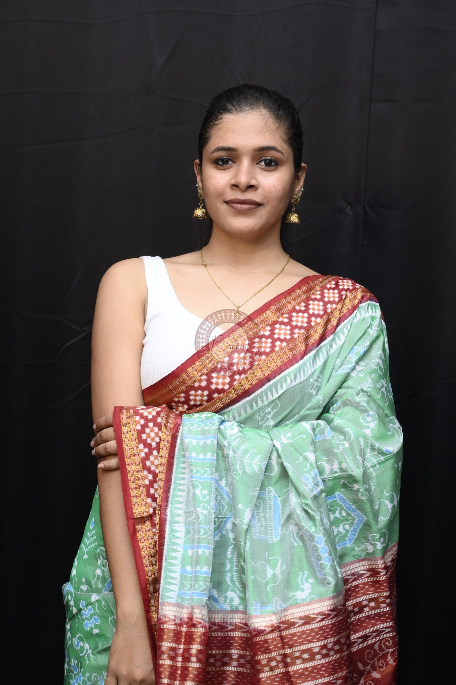 "Odisha Handloom Tissue Silk Saree with shimmering texture, elegant zari border, and lightweight drape, handcrafted by artisans"