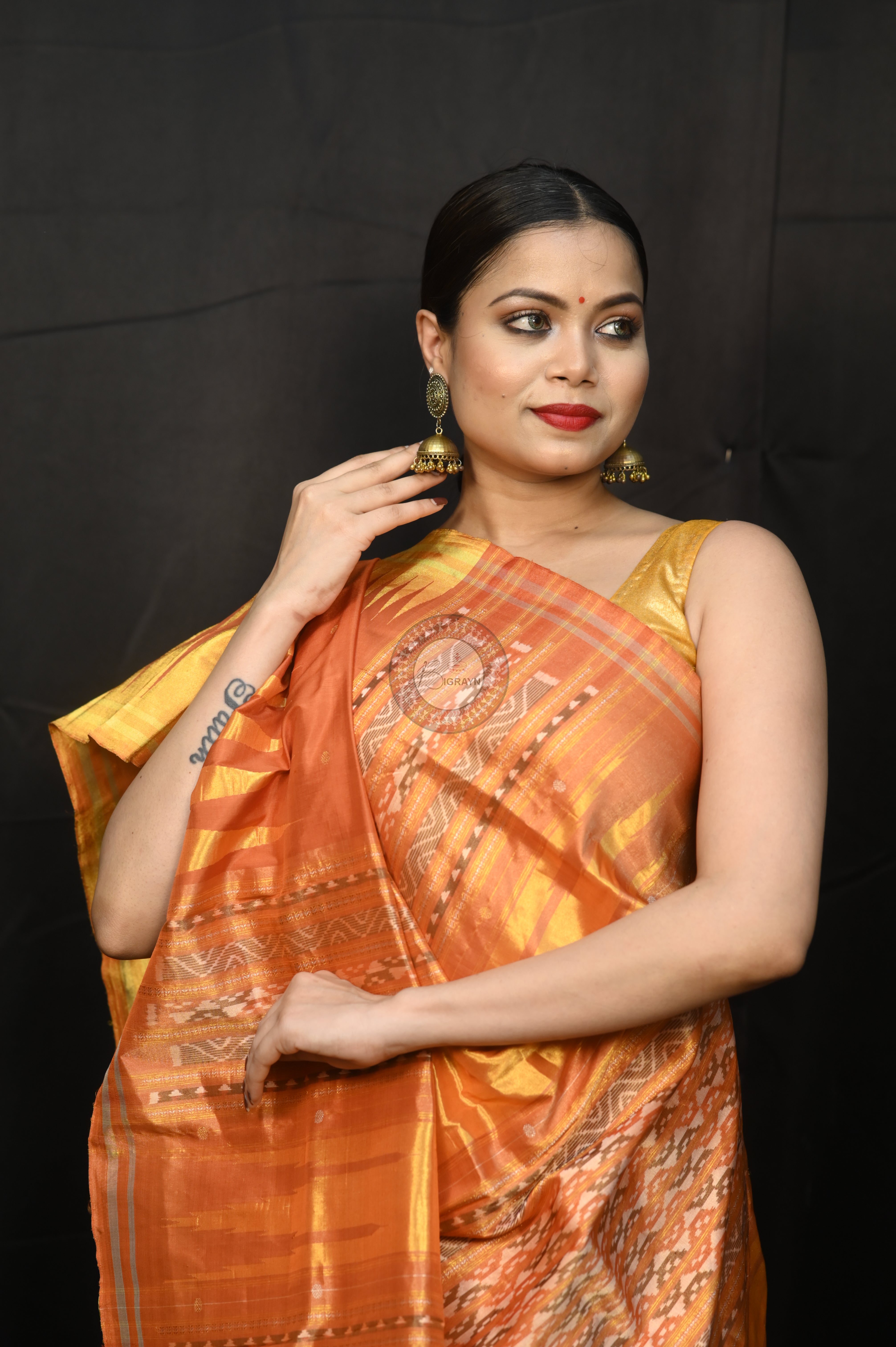 "Odisha Handloom Tissue Silk Saree with shimmering texture, elegant zari border, and lightweight drape, handcrafted by artisans"