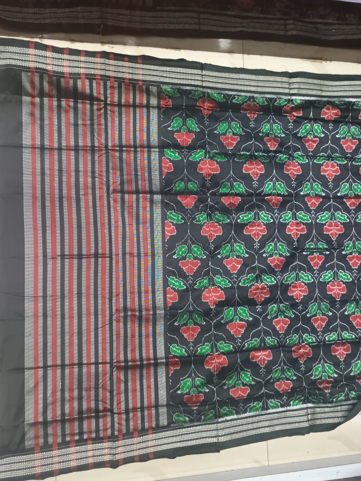 Midnight Black Handwoven Sambalpuri Silk Saree with Vibrant Red and Green Floral Vani Motifs