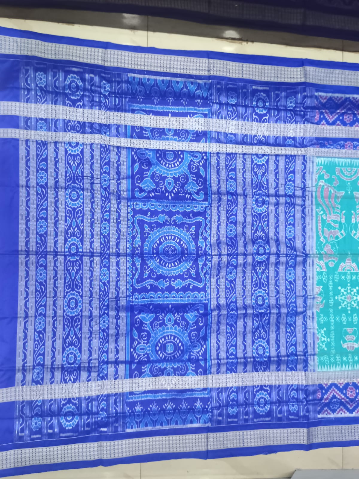 Sea Green & Royal Blue Handwoven Sambalpuri Silk Saree with Tribal Dancing Figures and Mandala Pallu