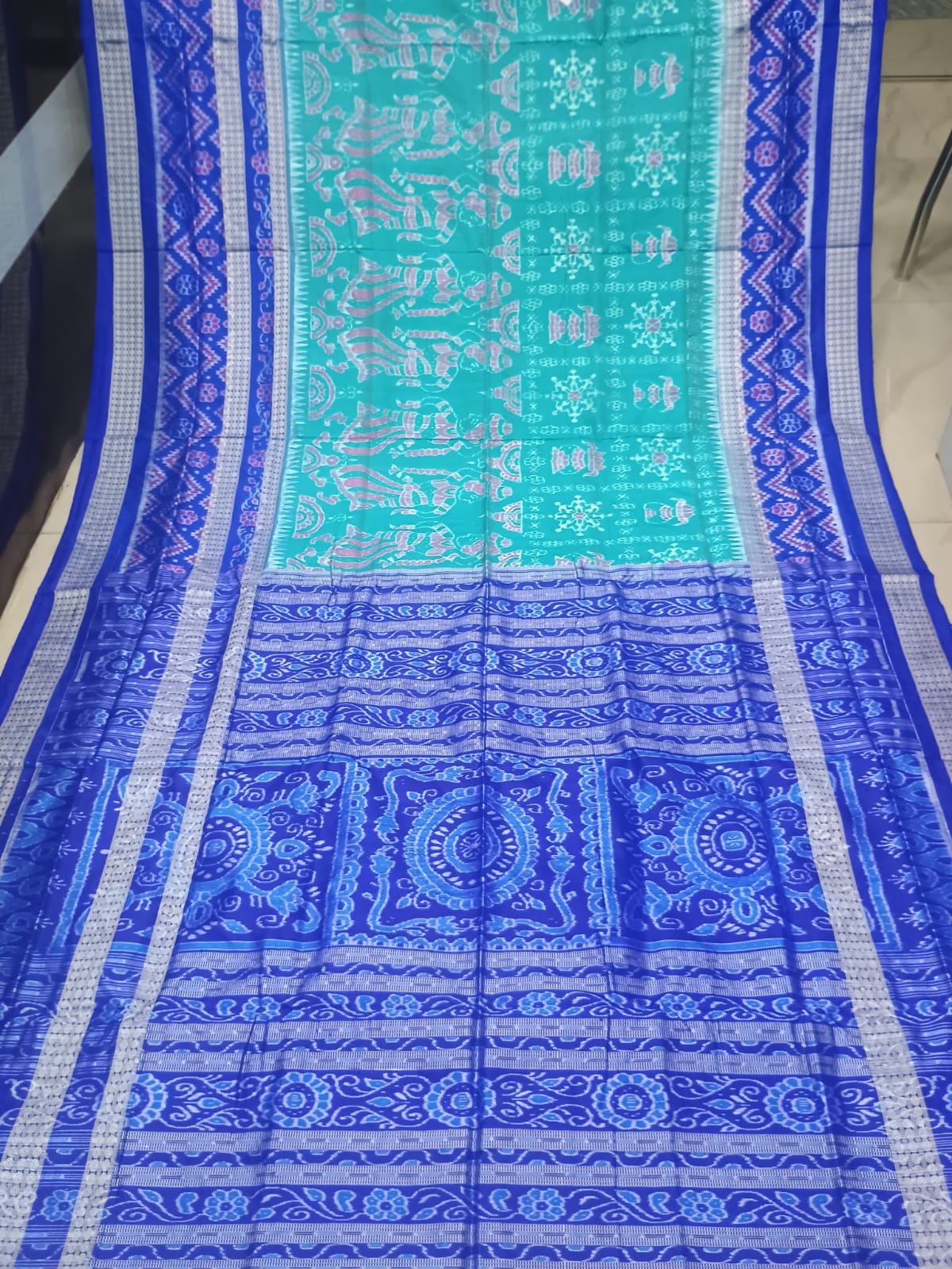 Sea Green & Royal Blue Handwoven Sambalpuri Silk Saree with Tribal Dancing Figures and Mandala Pallu