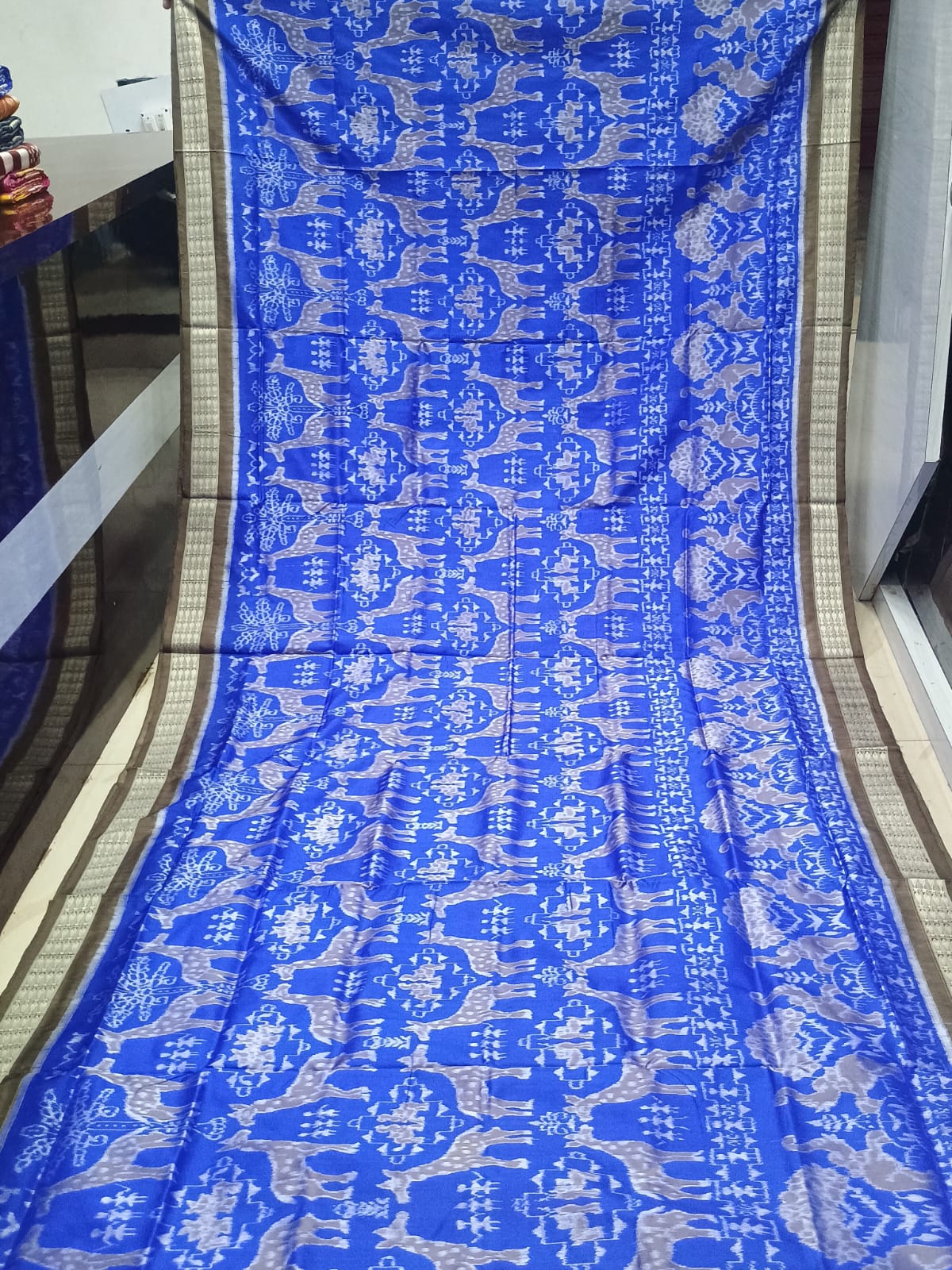 Royal Blue and Antique Bronze Handwoven Sambalpuri Bomkai Silk Saree with Wildlife Motifs