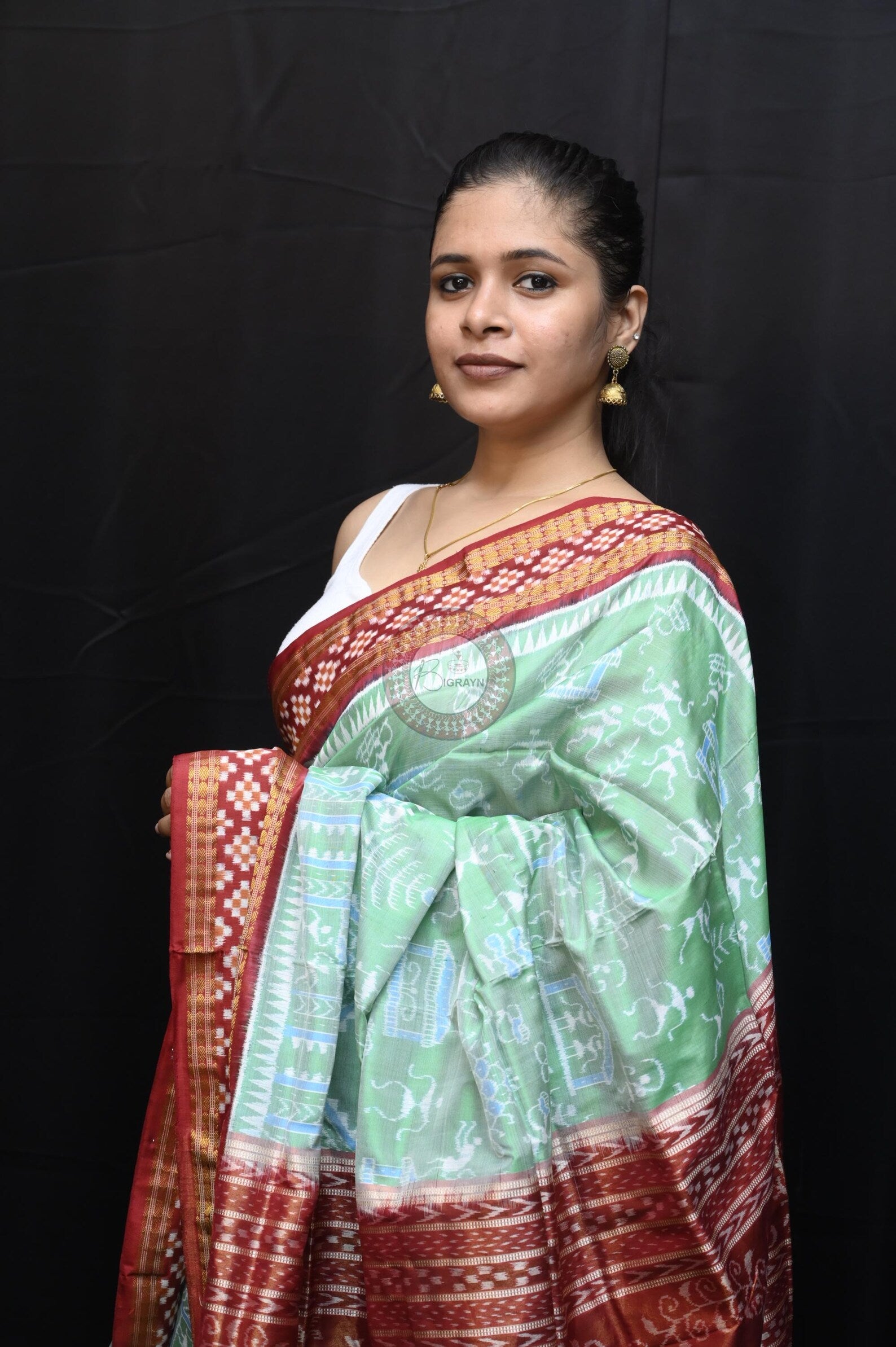 "Odisha Handloom Tissue Silk Saree with shimmering texture, elegant zari border, and lightweight drape, handcrafted by artisans"